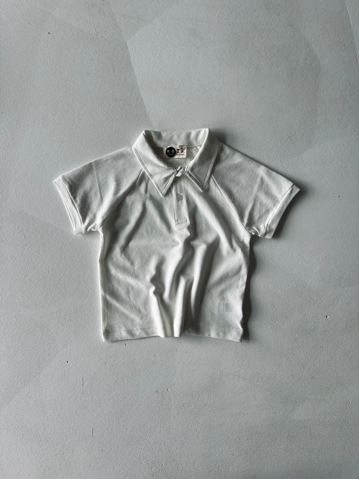 Tricou cu guler polo pentru copii | Material piqué, croială lejeră | Vârste 3-9 ani | RG1585 - ALB